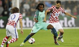 William Carvalho is challenged by Croatia's Luka Modric and Milan Badelj during the Euro 2016. AP