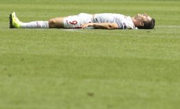 Robert Lewandowski lies on the pitch during the Euro 2016 round of 16 soccer against Switzerland. AP